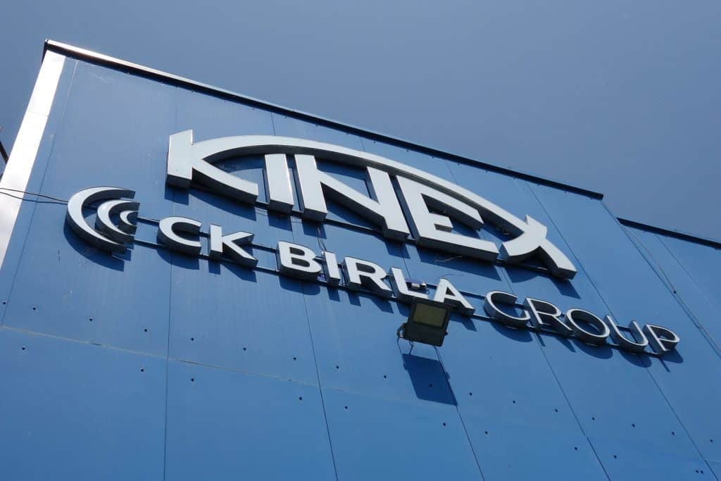 Friendly professional woman in a job interview or career discussion in a modern office setting.